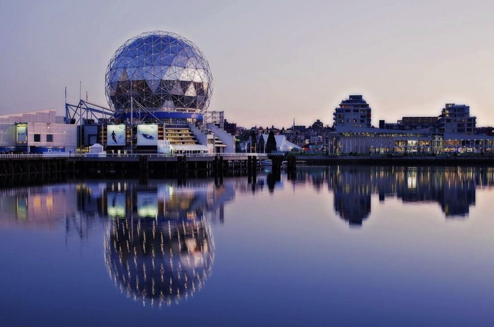 Vancouver skyline: Science World from False Creek artistically reflected in the waters of False Creek